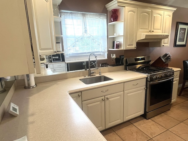 67 De Sibio Pl Unit 67, Inwood, NY 11096 - kitchen with stainless steel range with gas cooktop, open shelves, under cabinet range hood, and light countertops