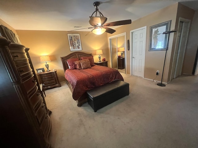 67 De Sibio Pl Unit 67, Inwood, NY 11096 - bedroom with light colored carpet, ceiling fan, and multiple closets