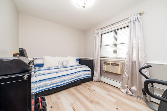 2261 Palmer Ave Unit 1O, New Rochelle, NY 10801 - bedroom featuring a baseboard radiator and wood finished floors