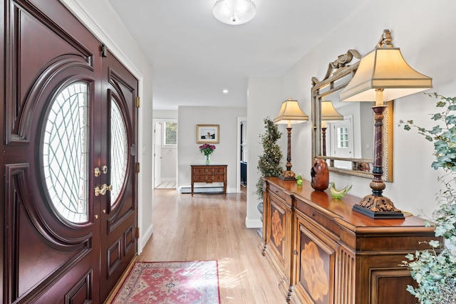 8 Pippin Ln, Lloyd Harbor, NY 11743 - entrance foyer with light wood finished floors, a baseboard radiator, and recessed lighting