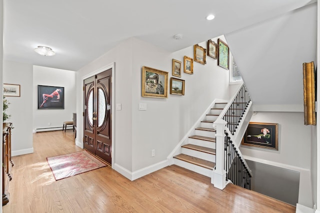8 Pippin Ln, Lloyd Harbor, NY 11743 - entryway featuring wood finished floors, a baseboard heating unit, stairs, and recessed lighting