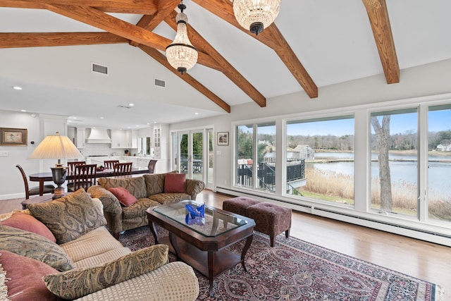 8 Pippin Ln, Lloyd Harbor, NY 11743 - living area featuring wood finished floors, beam ceiling, a water view, recessed lighting, and high vaulted ceiling