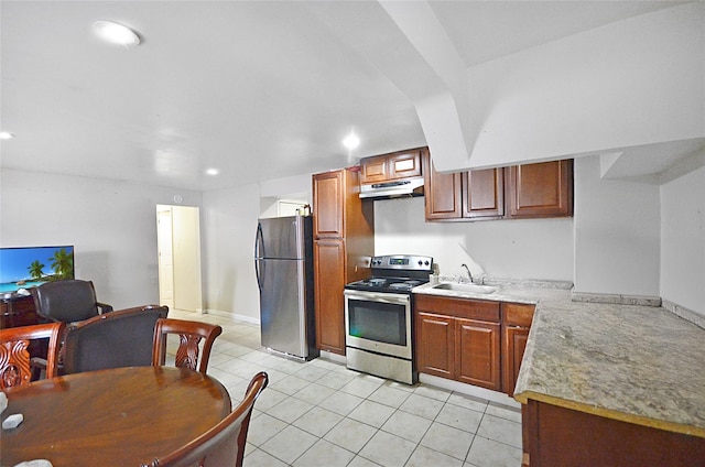 3070 Lasalle Ave, Bronx, NY 10461 - kitchen featuring freestanding refrigerator, stainless steel range with electric stovetop, under cabinet range hood, light tile patterned floors, and light countertops