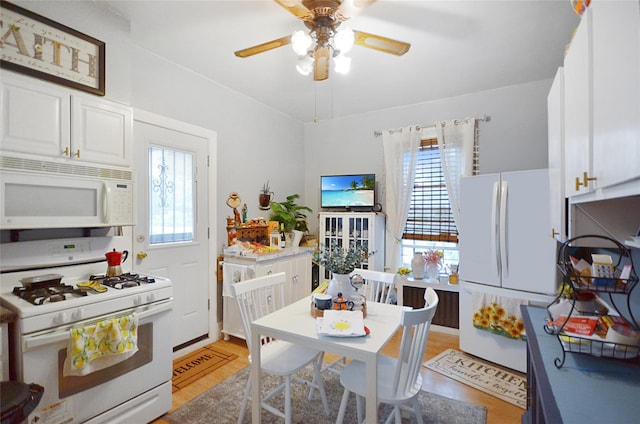 3070 Lasalle Ave, Bronx, NY 10461 - kitchen with white appliances, light wood finished floors, white cabinetry, and ceiling fan