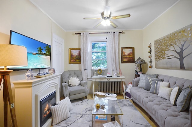 3070 Lasalle Ave, Bronx, NY 10461 - living area featuring ceiling fan, wood finished floors, ornamental molding, and a glass covered fireplace