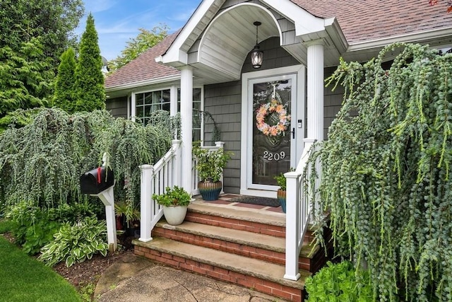 2209 Post St, East Meadow, NY 11554 - doorway to property featuring a shingled roof