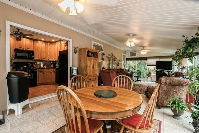 2209 Post St, East Meadow, NY 11554 - dining area featuring ceiling fan, stone tile floors, and ornamental molding