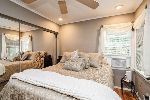 2209 Post St, East Meadow, NY 11554 - bedroom featuring wood finished floors, a closet, a ceiling fan, crown molding, and cooling unit