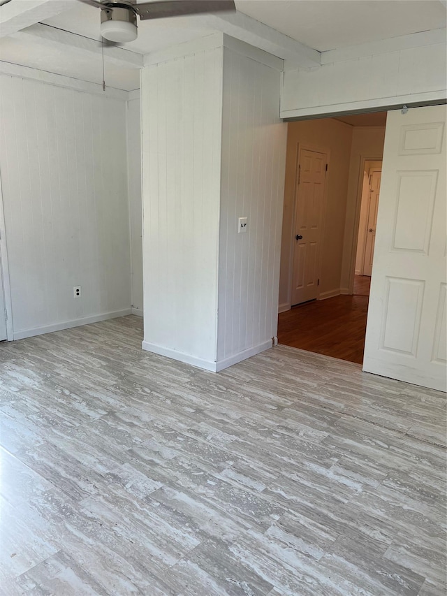 26 Sherman Rd, Farmingdale, NY 11735 - unfurnished room featuring wood finished floors, wooden walls, and beamed ceiling