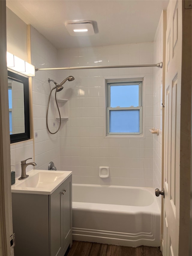 26 Sherman Rd, Farmingdale, NY 11735 - bathroom with vanity, wood finished floors, and bathing tub / shower combination