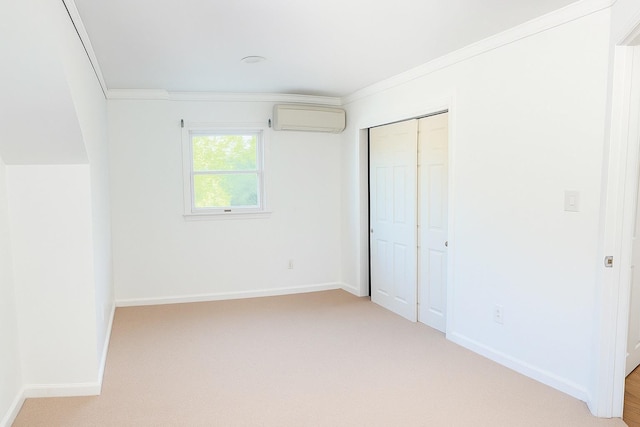 26 Sherman Rd, Farmingdale, NY 11735 - unfurnished bedroom with a wall unit AC, ornamental molding, a closet, and light colored carpet
