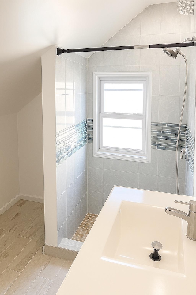26 Sherman Rd, Farmingdale, NY 11735 - full bathroom featuring vaulted ceiling and tiled shower