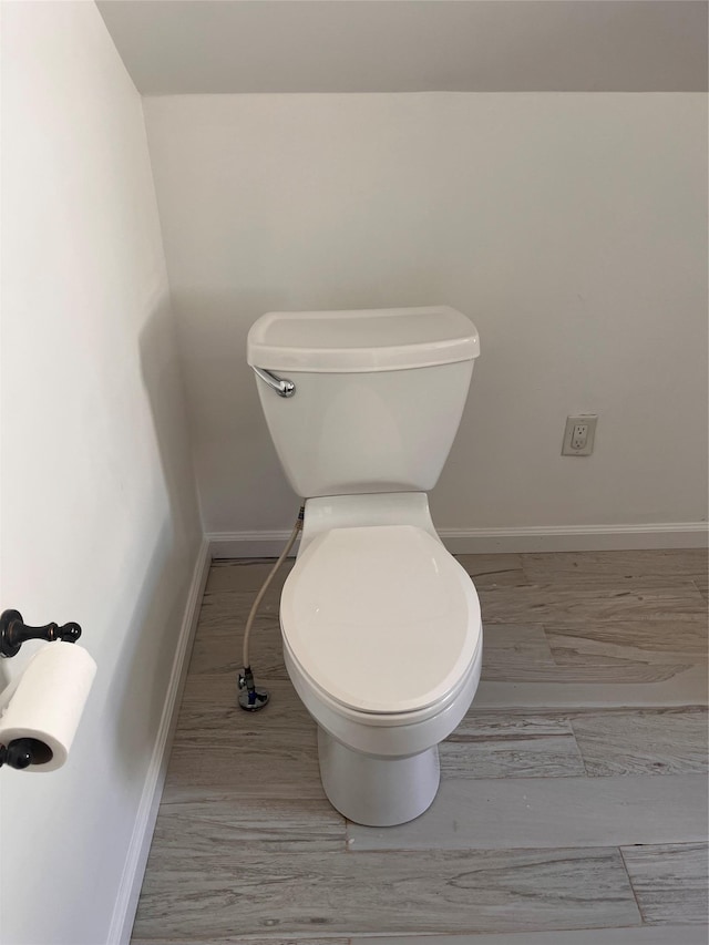 26 Sherman Rd, Farmingdale, NY 11735 - bathroom featuring toilet and baseboards