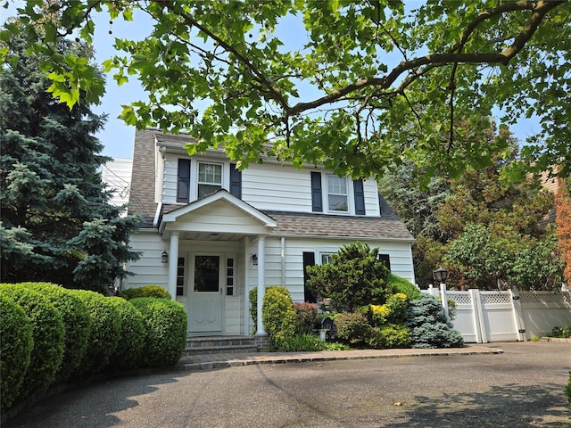 1277 Jerusalem Ave, Merrick, NY 11566 - view of front facade featuring a chimney and roof with shingles