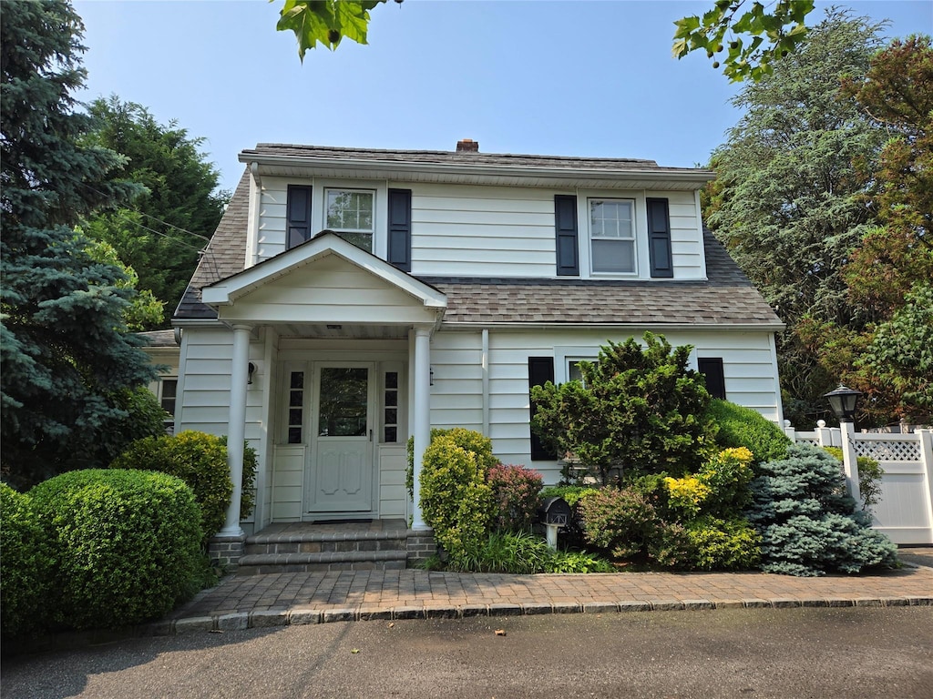 1277 Jerusalem Ave, Merrick, NY 11566 - view of front of house with a chimney and roof with shingles