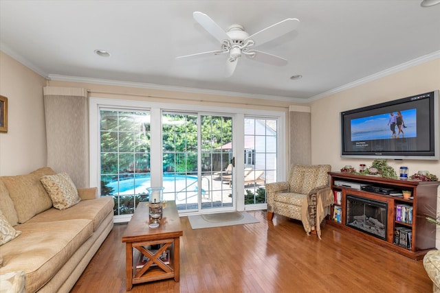 1277 Jerusalem Ave, Merrick, NY 11566 - living room featuring wood finished floors, ceiling fan, and ornamental molding
