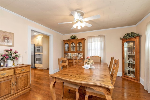 1277 Jerusalem Ave, Merrick, NY 11566 - dining space with a ceiling fan, crown molding, and light wood-style flooring