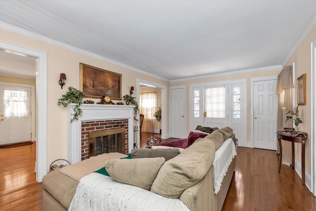 1277 Jerusalem Ave, Merrick, NY 11566 - living room featuring wood finished floors, crown molding, and a brick fireplace
