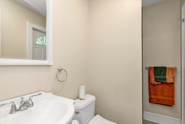 1277 Jerusalem Ave, Merrick, NY 11566 - half bathroom with a sink and toilet