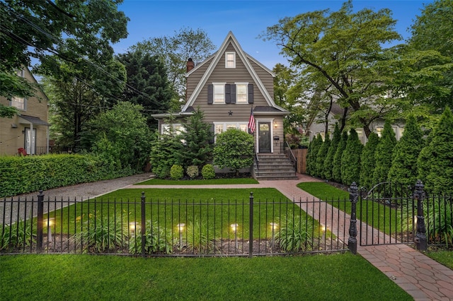 10 Wiltshire St, Bronxville, NY 10708 - view of front of property with a fenced front yard and a chimney