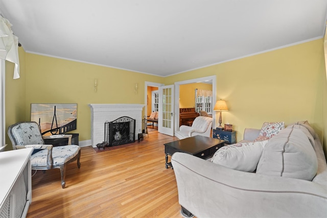 10 Wiltshire St, Bronxville, NY 10708 - living area featuring light wood-style floors, crown molding, and a fireplace