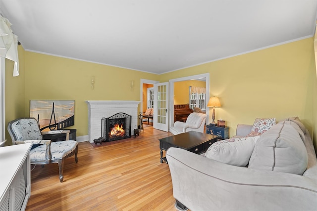 10 Wiltshire St, Bronxville, NY 10708 - living room with light wood-type flooring, a fireplace, and ornamental molding