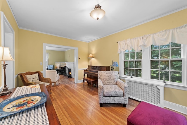 10 Wiltshire St, Bronxville, NY 10708 - living room with radiator heating unit, healthy amount of natural light, wood-type flooring, and crown molding