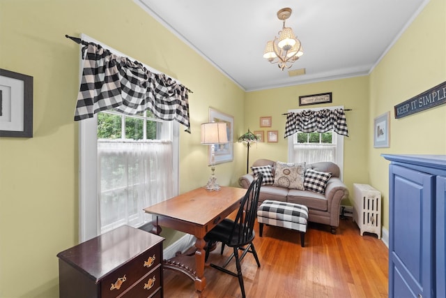 10 Wiltshire St, Bronxville, NY 10708 - home office with radiator heating unit, plenty of natural light, crown molding, a chandelier, and wood finished floors
