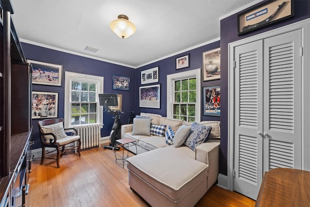 10 Wiltshire St, Bronxville, NY 10708 - sitting room with plenty of natural light, hardwood / wood-style flooring, radiator heating unit, and ornamental molding
