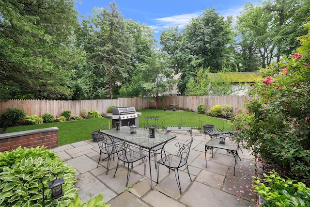 10 Wiltshire St, Bronxville, NY 10708 - fenced backyard featuring a grill, outdoor dining area, and a patio area