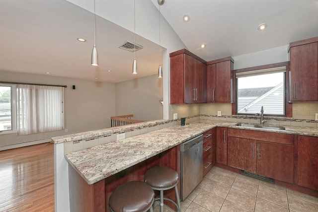 36 Dawes Ave, Syosset, NY 11791 - kitchen with stainless steel dishwasher, a peninsula, healthy amount of natural light, light stone counters, and recessed lighting