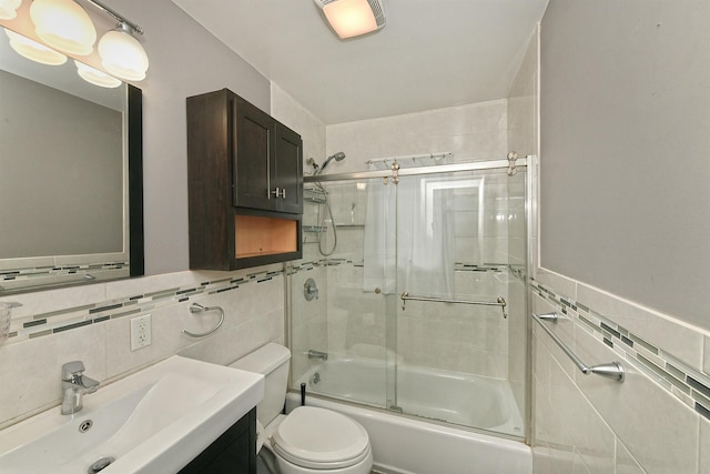 36 Dawes Ave, Syosset, NY 11791 - bathroom featuring tile walls, vanity, and shower / bath combination with glass door