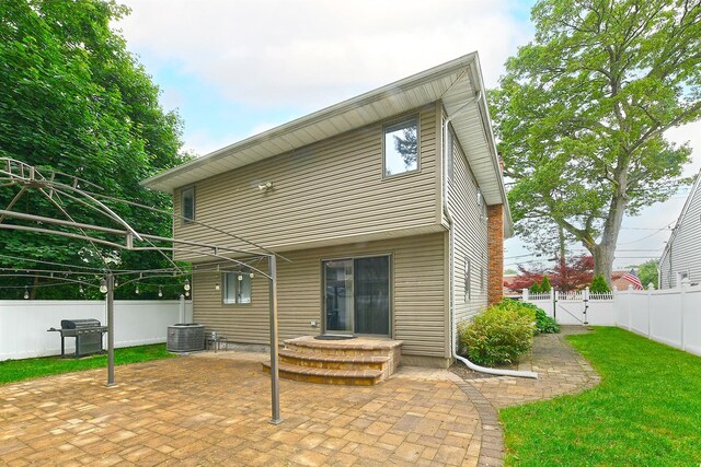 36 Dawes Ave, Syosset, NY 11791 - rear view of house with a patio area and a fenced backyard