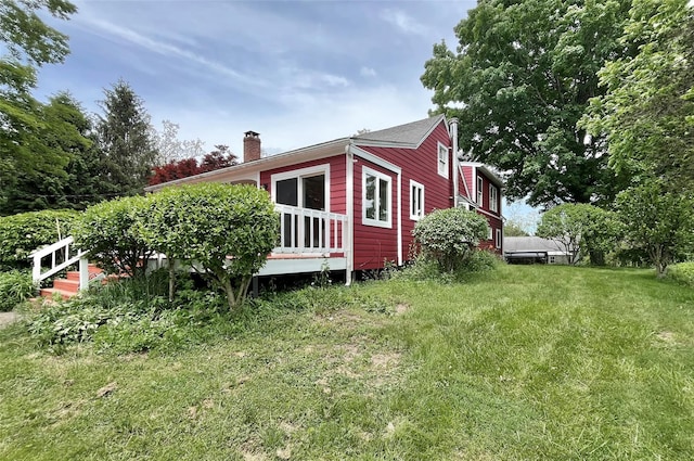 28 Gobblers Knob Rd, Pawling, NY 12564 - view of home's exterior with a chimney