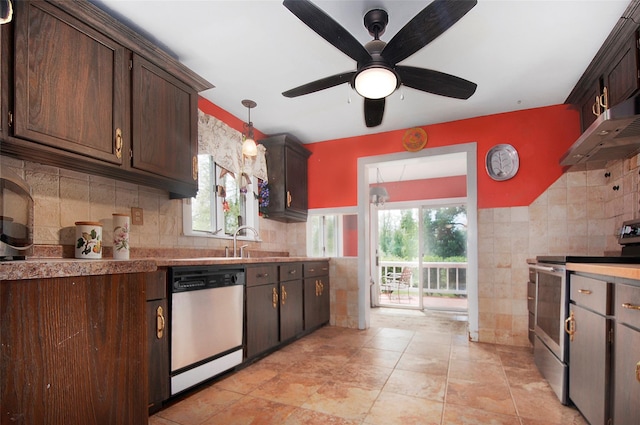 28 Gobblers Knob Rd, Pawling, NY 12564 - kitchen featuring stainless steel appliances, tile walls, healthy amount of natural light, and dark brown cabinetry