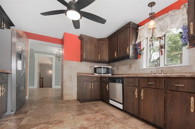 28 Gobblers Knob Rd, Pawling, NY 12564 - kitchen with appliances with stainless steel finishes, a ceiling fan, dark brown cabinetry, tasteful backsplash, and light stone finish flooring