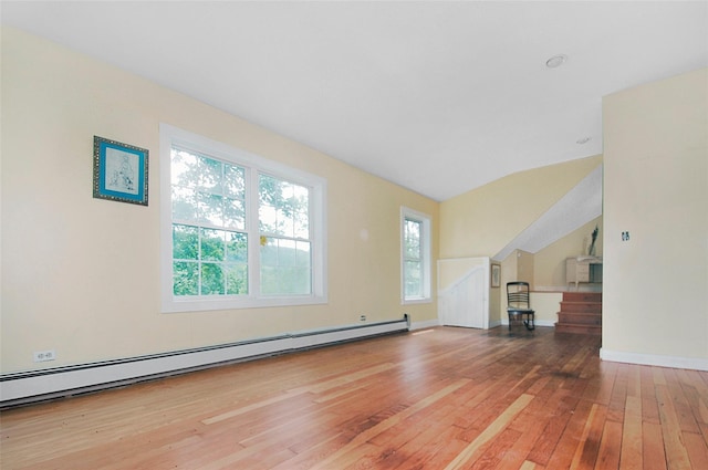 28 Gobblers Knob Rd, Pawling, NY 12564 - unfurnished living room featuring light wood-style floors, a baseboard radiator, and vaulted ceiling