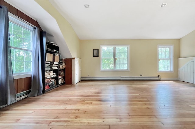28 Gobblers Knob Rd, Pawling, NY 12564 - unfurnished living room featuring healthy amount of natural light, light wood-style floors, lofted ceiling, and a baseboard radiator