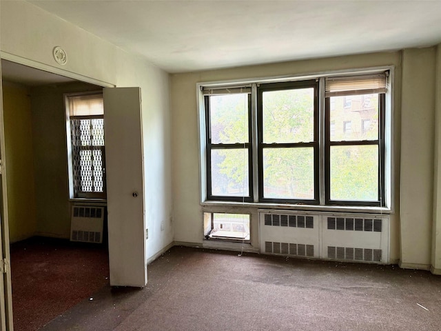 58-03 Calloway St Unit 3Ee, Corona, NY 11369 - empty room featuring radiator heating unit and carpet