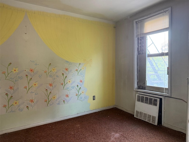 58-03 Calloway St Unit 3Ee, Corona, NY 11369 - empty room with radiator, plenty of natural light, and dark carpet