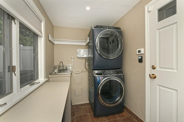 3223 214th St, Bayside, NY 11361 - laundry area featuring stacked washer / drying machine, dark tile patterned flooring, and recessed lighting
