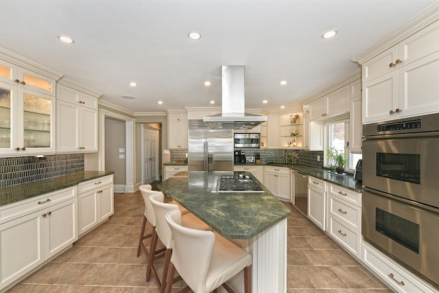 3223 214th St, Bayside, NY 11361 - kitchen with appliances with stainless steel finishes, island range hood, tasteful backsplash, open shelves, and a breakfast bar