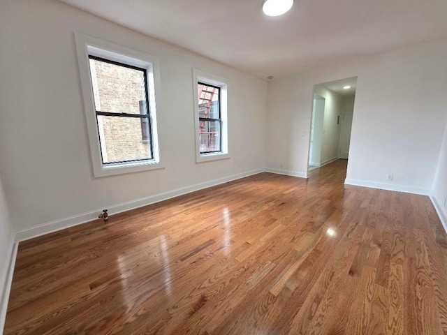 43-42 45th St Unit 4O, Sunnyside, NY 11104 - empty room featuring wood finished floors and baseboards