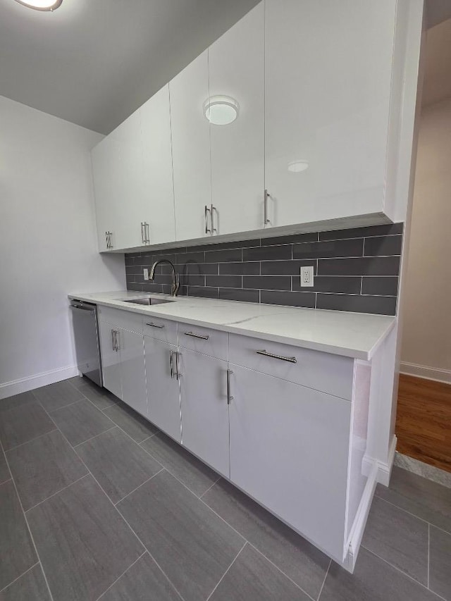 43-42 45th St Unit 4O, Sunnyside, NY 11104 - kitchen with dishwasher, white cabinetry, decorative backsplash, and dark tile patterned flooring