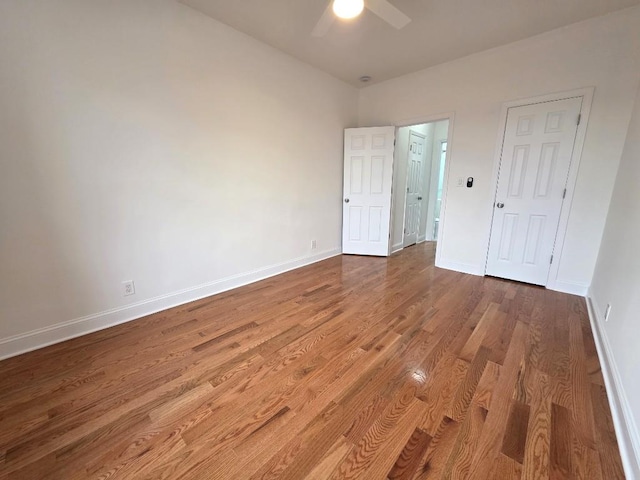 43-42 45th St Unit 4O, Sunnyside, NY 11104 - unfurnished bedroom featuring wood finished floors and a ceiling fan
