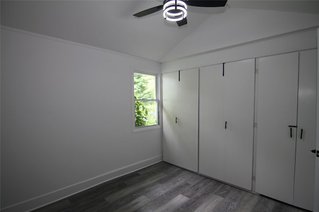 191 Sylvan Lake Rd Unit 1, Hopewell Junction, NY 12533 - unfurnished bedroom with vaulted ceiling, dark wood finished floors, a ceiling fan, and a closet