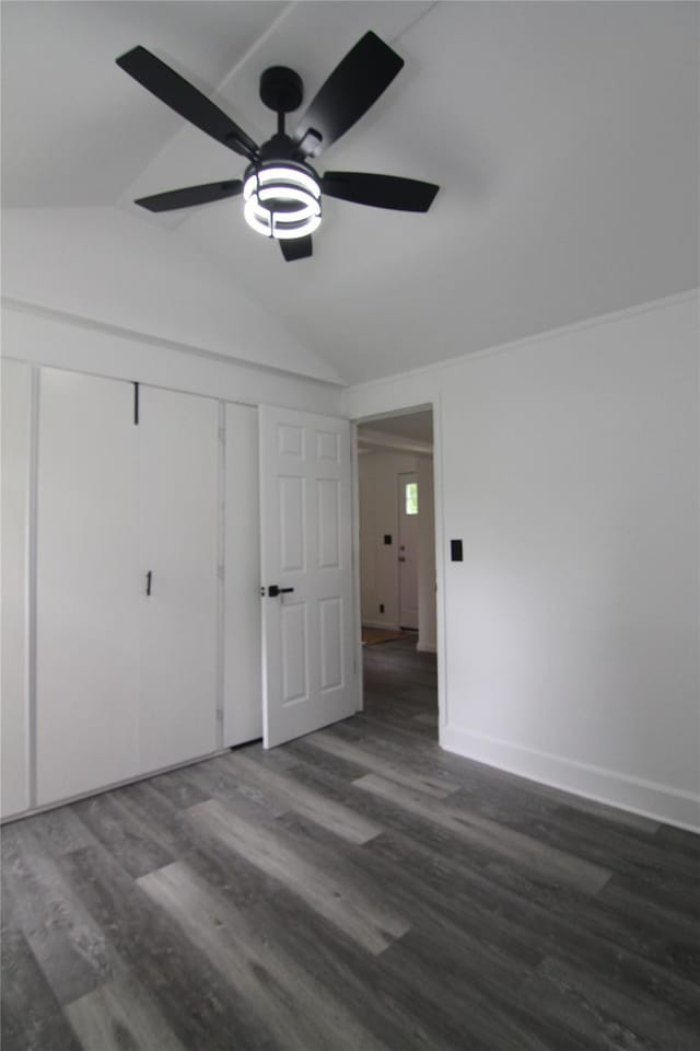 191 Sylvan Lake Rd Unit 1, Hopewell Junction, NY 12533 - unfurnished bedroom with vaulted ceiling, dark wood-style floors, ceiling fan, and a closet