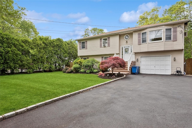 40 Dillmont Dr, Smithtown, NY 11787 - split foyer home featuring driveway, a garage, and a front lawn