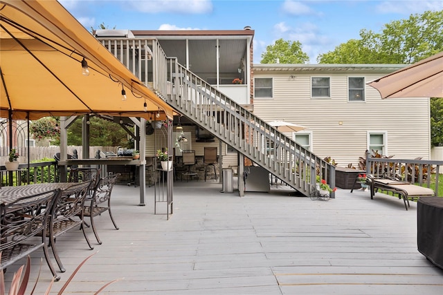 40 Dillmont Dr, Smithtown, NY 11787 - wooden terrace featuring stairs, outdoor dining space, a sunroom, and a gazebo