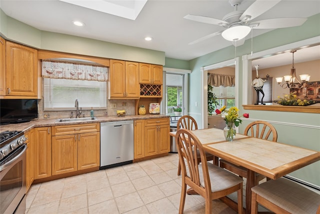 40 Dillmont Dr, Smithtown, NY 11787 - kitchen with stainless steel appliances, decorative backsplash, plenty of natural light, a ceiling fan, and recessed lighting